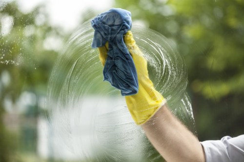 Local oven cleaner working in a compact Ealing flat kitchen