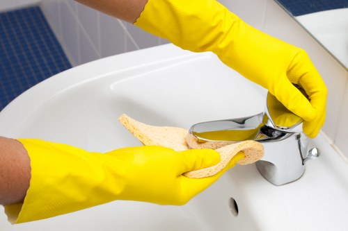 Local cleaning service preparing a kitchen and bathroom in Ealing