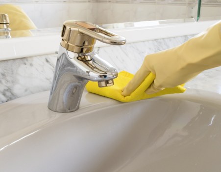 Cleaning operatives assessing carpet cleaning safety measures